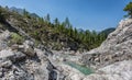 Bright rocks in narrow valley of mountain stream