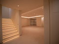 Bright room without windows with LEDs on the ceiling, a bright staircase, and cupboards