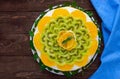 Bright round festive fruit cake decorated with kiwi, orange, mint. Royalty Free Stock Photo