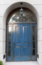 Bright royal blue exterior front door with architectural arch Royalty Free Stock Photo