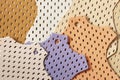 Bright samples of colorful perforated genuine leather, texture, for background