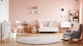Bright scandinavian baby room with rocking horse, white nursery and pink armchairs, posters on the wall. Generative AI Royalty Free Stock Photo