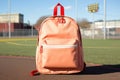 Bright school backpack in the schoolyard, learning concept