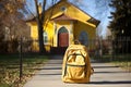 Bright school backpack in the schoolyard, learning concept