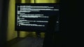 Bright screen coding, Developer working late at desk, IT startup founder examining prototype with concentration Royalty Free Stock Photo