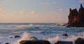 Bright sea sunset. The waves crash into the rock, lit by the warm sunset, pebbles, volcanic basalt in Tenerife Island Royalty Free Stock Photo