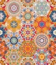 Bright seamless patchwork design from colorful hexagonal patterns. Print for fabric, textile, carpet, rug