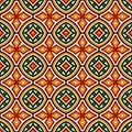 Bright seamless pattern with geometric ornament in Christmas traditional colors. Ethnic and tribal motifs. Royalty Free Stock Photo