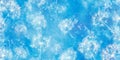 A bright, serene blue background featuring abstract dandelion-like patterns floating in the design.