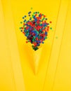 Bright series, confetti and cone yellow background, solid line. Royalty Free Stock Photo