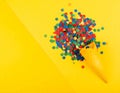 Bright series, confetti and cone yellow background, solid line. Royalty Free Stock Photo