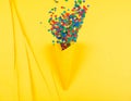 Bright series, confetti and cone yellow background, solid line. Royalty Free Stock Photo