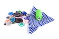 Bright sewing buttons, needle and skeins of thread