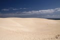 Bright shining white edge of sand dune contrasting against deep blue sky, Corralejo, Fuerteventura, Canary Islands