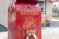 Bright shiny red mailbox for children to mail letters to Santa Claus Royalty Free Stock Photo