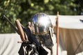 Bright shiny silver medieval knight helmet with reflections of sun rays