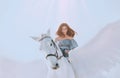 Bright sky and sunlight, majestic girl with dark flying hair riding horse, an angel in gray vintage dress with open bare Royalty Free Stock Photo