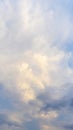 Bright sky with white and blue clouds, vertical format Royalty Free Stock Photo
