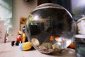 Bright small goldfishes in round glass aquarium on table in kids room Royalty Free Stock Photo