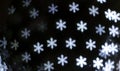 Bright snowflakes bokeh background.
