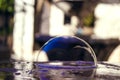 Bright soap bubble on the stone table