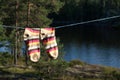 Bright socks drying after washing on the clotheline outdoors.