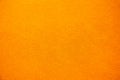 Bright solid color background. Empty orange surface with fine texture. Preparation for designer or layout Royalty Free Stock Photo