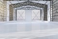 Bright spacious concrete empty hangar interior with city view and window frames. Factory and industrial concept.