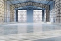 Bright spacious concrete empty hangar interior with sunlight, city view and window frames. Factory and industrial concept. 3D