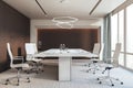 Bright spacious meeting room office interior with furniture and panoramic window with city view and daylight. Royalty Free Stock Photo