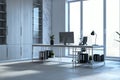 Bright spacious office interior with panoramic windows and city view, workplace and other objects.