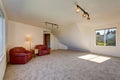 Bright spacious sitting area upstairs with vaulted ceiling.