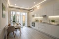 Spacious white kitchen interior after renovation Royalty Free Stock Photo