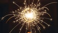 Bright Sparkler Exploding With Golden Light Trails Against Dark Background firework celebration Royalty Free Stock Photo