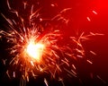 Bright sparklers on red background Royalty Free Stock Photo
