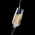Bright sparkling champagne stream pour in elegant glass on rich black background, copy space, closeup, detail, square. Festive New