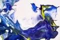 Bright spills of dark blue, blue, yellow colors on a white background. Abstract colorful painting