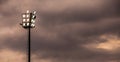 Bright sports stadium lights on a cloudy evening Royalty Free Stock Photo