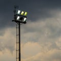 Bright sports stadium lights on a cloudy evening Royalty Free Stock Photo