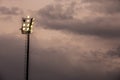 Bright sports stadium lights on a cloudy evening Royalty Free Stock Photo