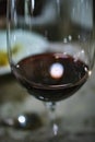 Bright spotlight on a red wine wineglass