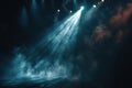 Bright spotlights illuminate the empty stage. A dark background, through which several bright stage lights shine, creating a Royalty Free Stock Photo