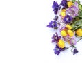 Bright spring flower arrangement. Lilac Alstroemeria and Aquilegia and yellow flowers of trolius europaeus on a white background.