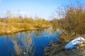 Bright spring landscape with a small river and blue sky Royalty Free Stock Photo