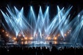 Bright stage lights illuminate a concert crowd Royalty Free Stock Photo