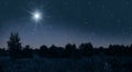 Bright star shines over the manger of christmas of Jesus Christ on blue starry sky. Royalty Free Stock Photo
