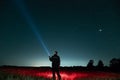 Bright stars and constellations in the night sky. The silhouette of a man against the background of the starry sky. A man shines a Royalty Free Stock Photo