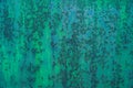 Bright streaks of blue-green paint on an old metal surface with picturesque rust spots and scratches. Royalty Free Stock Photo