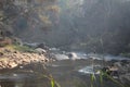 A stream in morning foggy mist