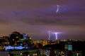 Bright strikes of lightning during an evening thunderstorm in Moscow